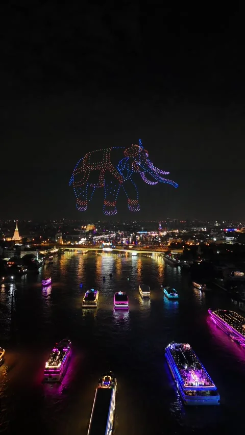 Drone Light Show Forming Elephant Over City River in Bangkok, Thailand Stock Footage 335969926