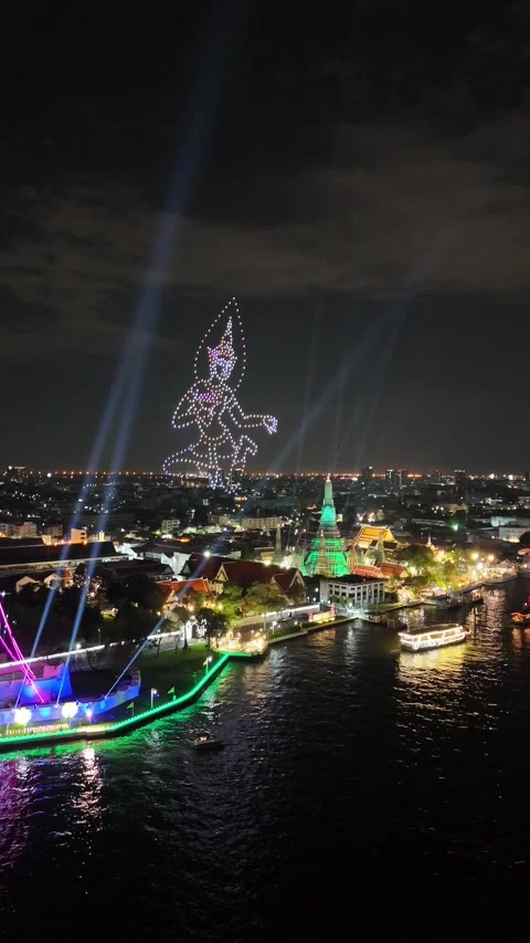 Drone Light Show Forming Thai Deity Over Wat Arun in Bangkok, Thailand Stock Footage 335839778