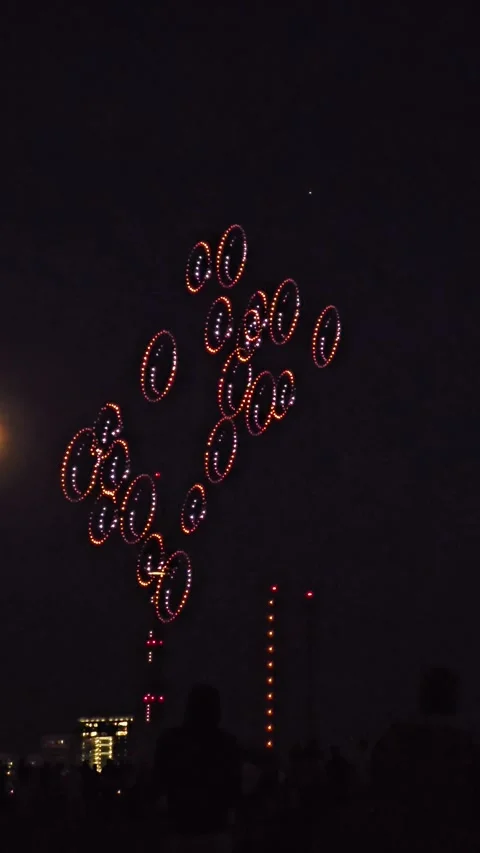Drone Light Show in the Shape of Rings or Bubbles in the Night Sky Stock Footage 341595250