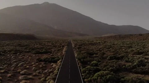 Drone long straight road mountain peak sunset Stock Footage 221278950
