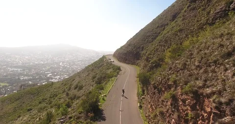 Drone of longboarder on edge of mountain Stock Footage 120336548