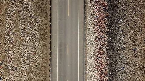 Drone Looking Down Flying Symmetrically over Highway 動画素材 87342086