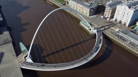 Drone looking down onto Gateshead Millennium Bridge Stock Footage 303347534