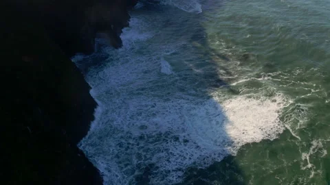 Drone looking down into the Oregon coastline ocean in a sunny day Stock Footage 145821042