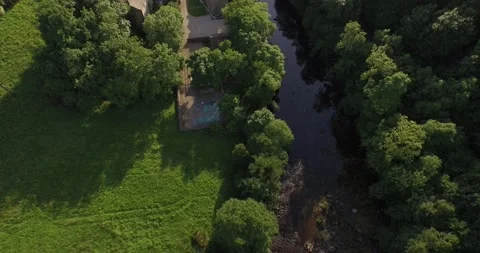 Drone looking down over Asgarth Falls in Yokrshire Stock Footage 135754899