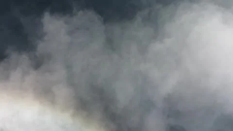 Drone looking down over lake, flies over a cloud. Sun reflects the water. Stock-Footage 319827686