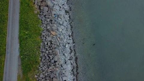 Drone looking down on a rocky beach 스톡 동영상 111654203