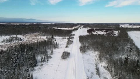 Drone looking down onto a snow covered country road  Stock Footage 221502878