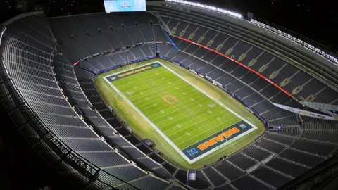Drone looking inside the empty Soldier Field stadium at Chicago Bears game night Stock Footage 329280943