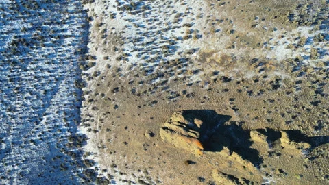 Drone looking straight down and panning up, snowy sage and mountains Stock Footage 326355079