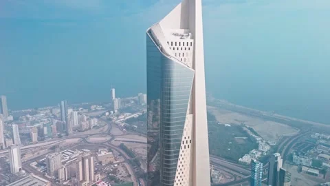 Drone Low Angle Kuwait City Modern Skyscrapers, Twisting Facade Tower and Glass Video stock 324950983