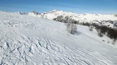 Drone low flight backward in snowy mountain landscape, Alps 4K Stock Footage 147858777