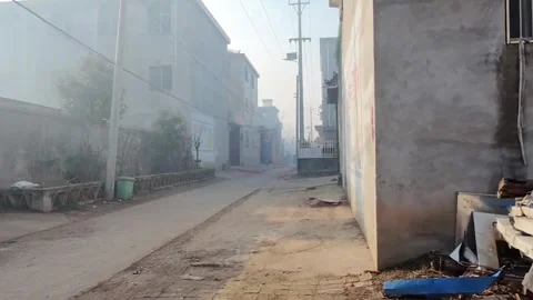 Drone Low Flying Through Narrow Village Alley in Rural China Video stock 330142471