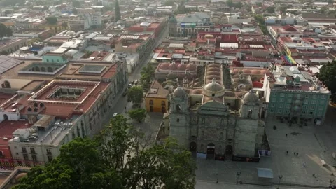 DRONE: LOW ORBIT OF THE OAXACA CATHEDRAL AT THE EARLY MORNING Stock Footage 313467935