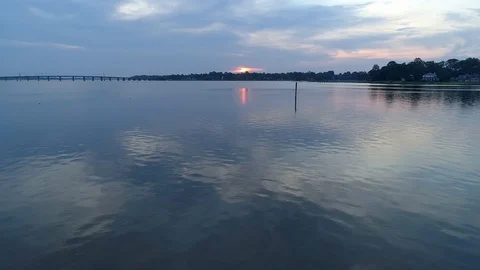 Drone low water reflections of the rising sun Stock Footage 111526211