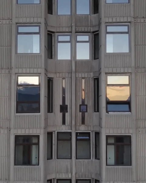 Drone lowering parallel to a residential building Stock Footage 93838138
