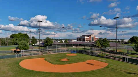 Drone lowering toward baseball diamond Stock Footage 207524750