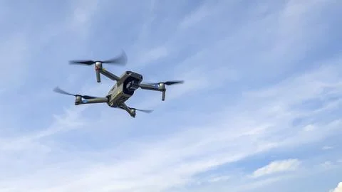 Drone machine with blue sky background for commercial marketing. Drone servic Stock Photos