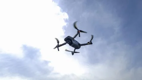 Drone machine with blue sky background for commercial marketing. Drone servic Stock Photos
