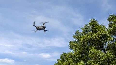 Drone machine with blue sky background for commercial marketing. Drone servic Stock Photos