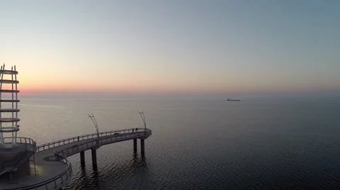 Drone maneuvering to the left while capturing the Sunrise at the Burlington Pier Stock Footage 55264327