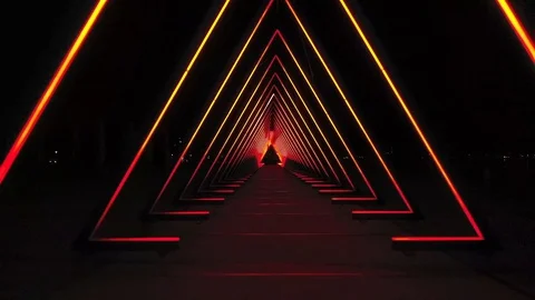 Drone maneuvers through a light installation in a perfectly mesmerizing Stock Footage 128447473
