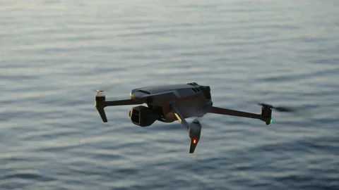 Drone mavic 3 hover in point sea on background Stock Footage 232959182
