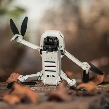 Drone Mavic Mini supported in vertical position with the propellers open. Stock Photos