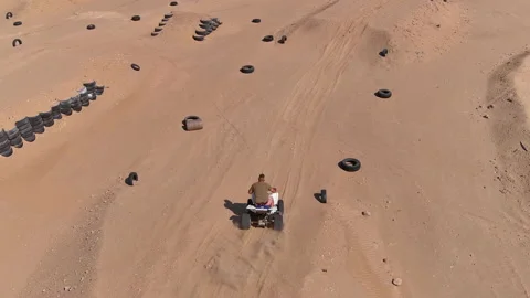 Drone motion track four-wheeler on a course B (4K) Video stock 202637882
