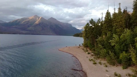 Drone Mountain Lake Pan at Sunset  Stock Footage 125990656