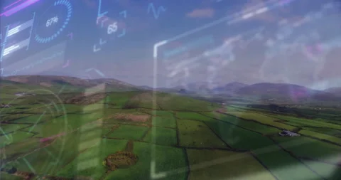 Drone-mounted camera initiating scan while soaring over farmland as telemetry 動画素材 311585389