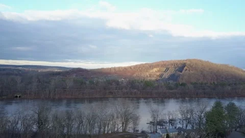 Drone move away or river in winter with partly cloudy sky 스톡 동영상 144492254