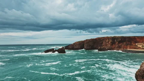 Drone in movement above wild ocean cost Stock Footage 203596847