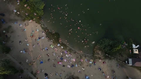 Drone movement along a beach full of people Stock Footage 167132481