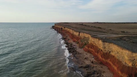 Drone movement along the seashore on an evening summer day Stock Footage 165542467