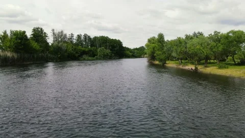 Drone movement along a wide river in summer. aerial shooting Video stock 160988673