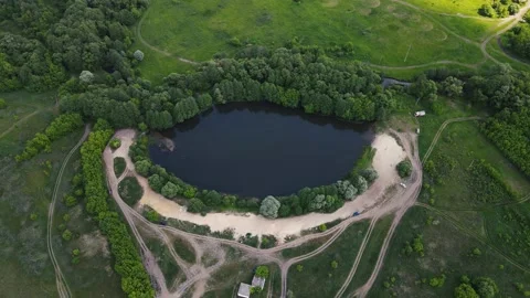Drone movements around a small lake. aerial shooting 4k footage Video stock 156728237