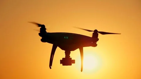 Drone moves in the air against the sunset background Stock Footage
