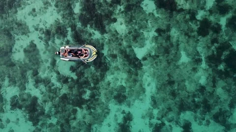 Drone moves away from boat with two vacationing tourists. Two travelers Stock Footage 231900532