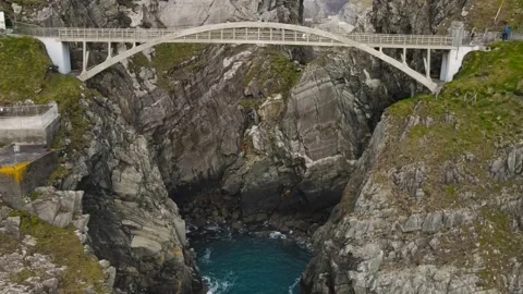 Drone moves away from the bridge of Mizen Head in Ireland without people Stock Footage 233195932