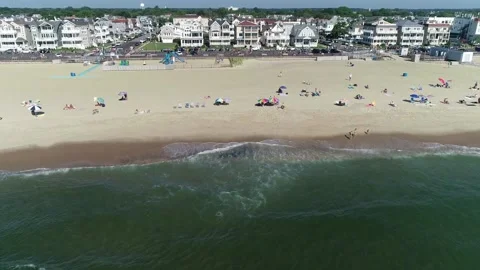 Drone moves over breaking waves to race on Boardwalk Video stock 170575281