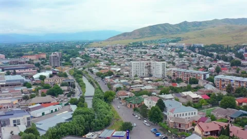 Drone moves sideways across Gori in Georgia, revealing broad avenues Stock Footage 340767970