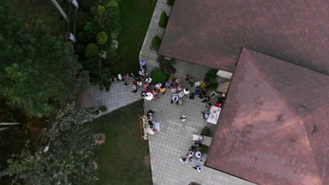 The drone moves sideways and circles over the forest wedding venue. Stock Footage 169483052