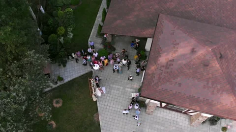 The drone moves sideways and circles over the forest wedding venue. Stock Footage 169498073
