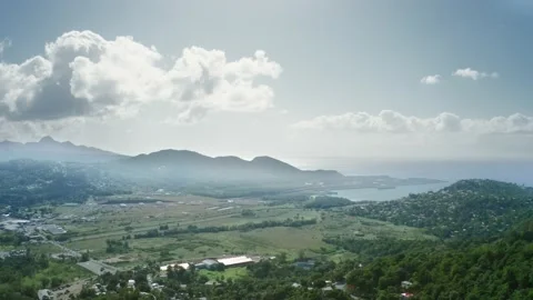 Drone moves smoothly over a settlement in the mountains (Saint Lucia) Video stock 131586094