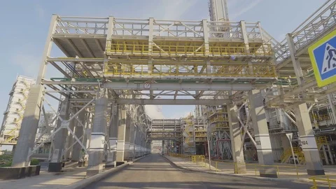 Drone Moves under Metal Construction along Refinery Territory Stock Footage 81085627