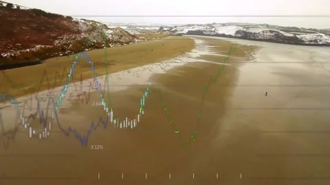 Drone moving along beach, midway fade in starting data overlay animating to show Stock Footage 333965116