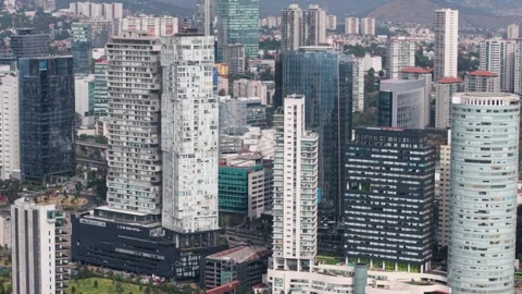 Drone moving backward with parallax effect over Santa Fe, Mexico City Video stock 305432887