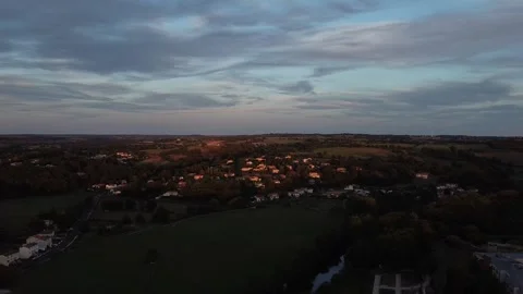 Drone Moving Backward Revealing Two Churches with Illuminated Crosses in France Stock Footage 331661570