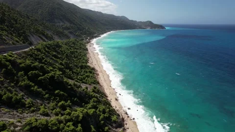 Drone moving backwards in lefkada greece. Late september days. Big waves and wil Stock Footage 214078309